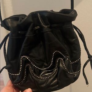 Stylish Black Drawstring Mini Bag with Studded Accents